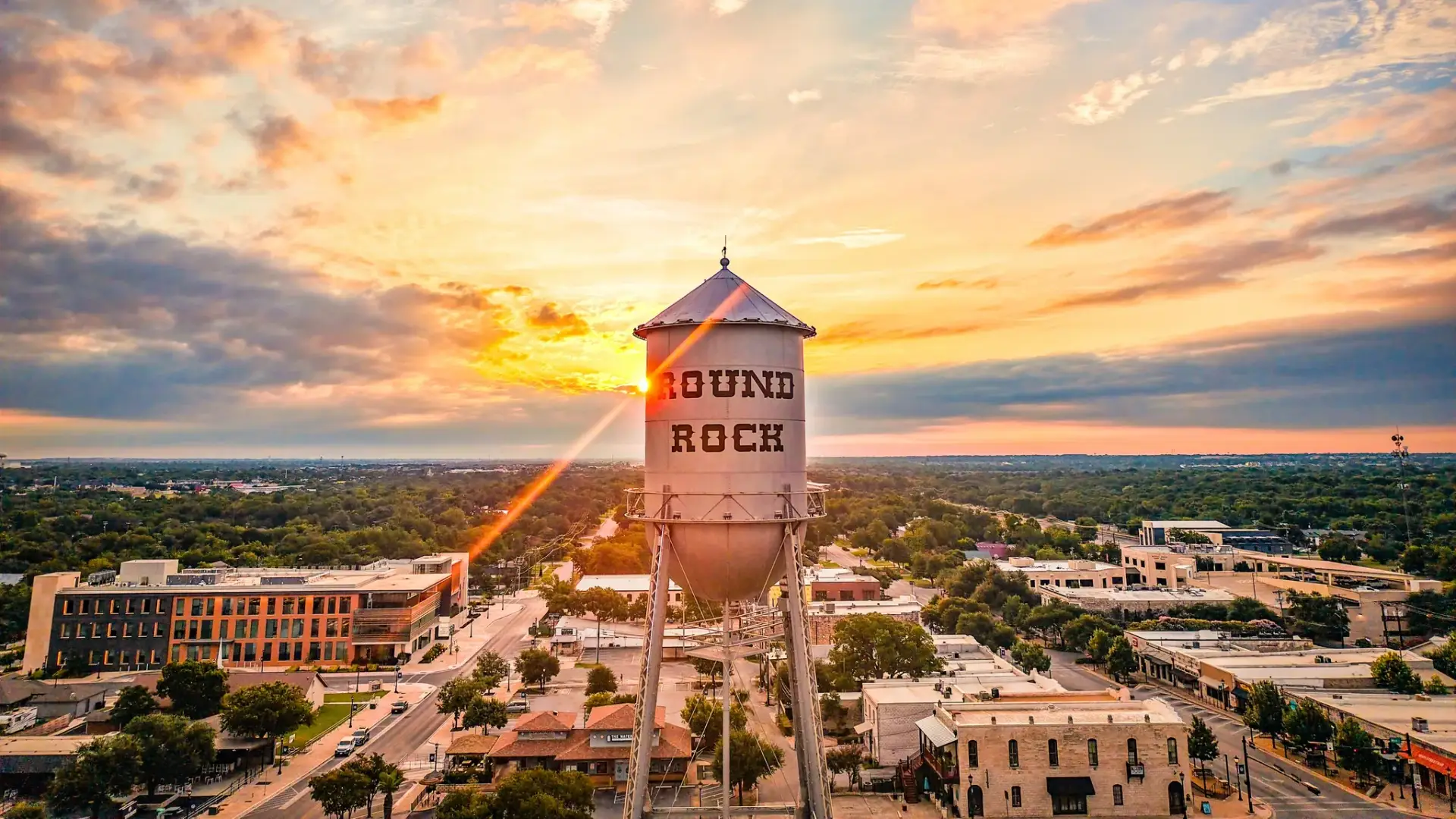 The Best Neighborhoods in Austin and Central Texas for Families Relocating for Work 1 Sunset over Round Rock water tower.