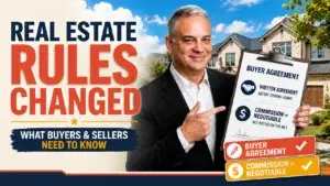 Blog 1 Man in black suit pointing at a real estate contract
